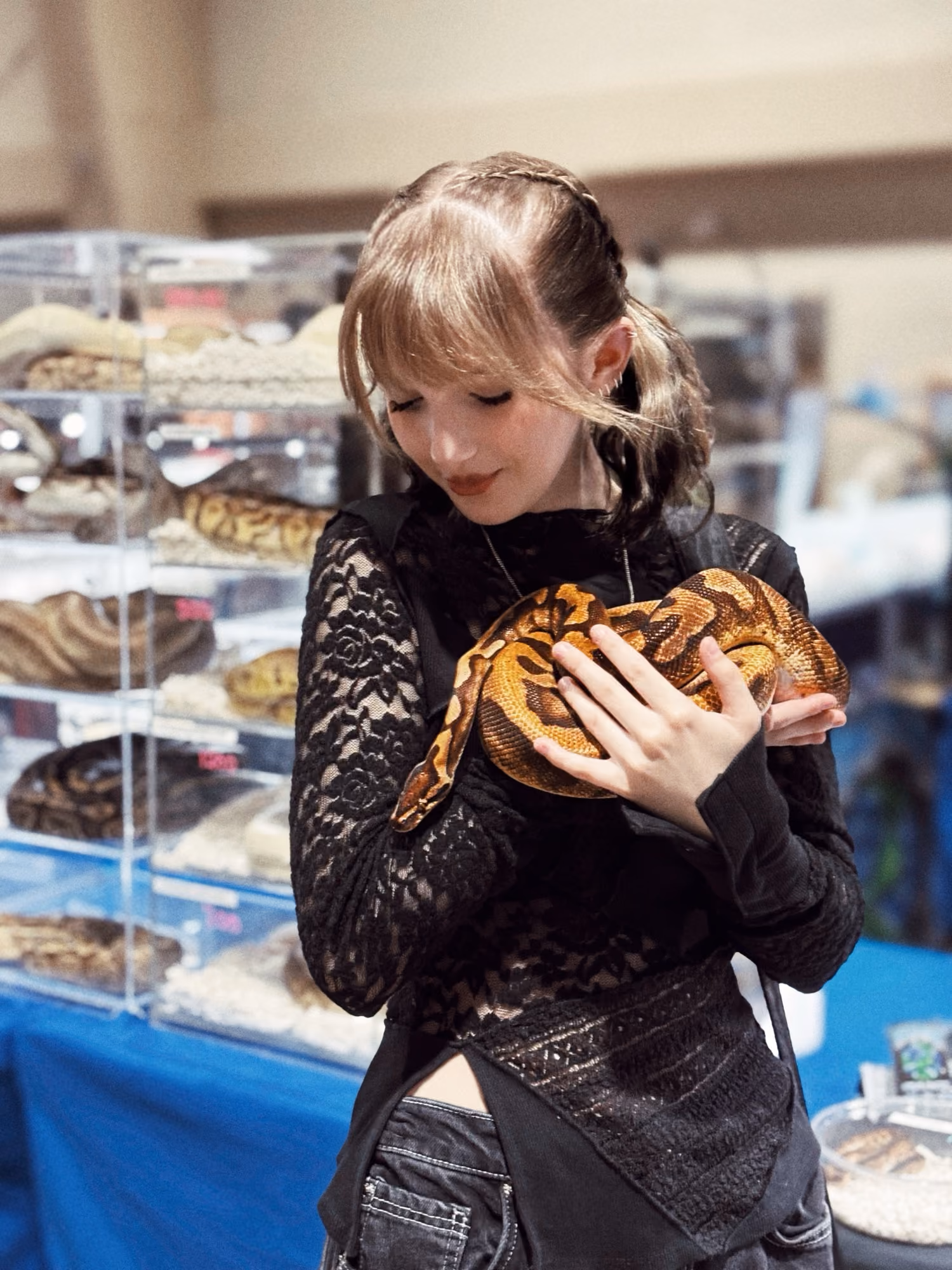 The Reptile Gal holding a snake at an expo